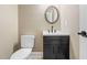 Stylish powder room with modern vanity and fixtures at 102 Traviliah Oaks Ln, Cary, NC 27518