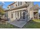 This backyard features French doors that let lots of light in and a cozy patio at 103 Aisling Ct, Cary, NC 27513
