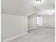 Spacious bonus room featuring neutral carpet, a ceiling fan, and dormer ceilings at 103 Aisling Ct, Cary, NC 27513