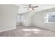 Bonus room with carpet, ceiling fan, and natural light at 103 Aisling Ct, Cary, NC 27513