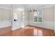 Spacious dining area featuring hardwood floors, chandelier, and natural light at 103 Aisling Ct, Cary, NC 27513