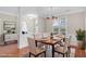Cozy dining room with elegant chandelier, table set for six, and decorative accents at 103 Aisling Ct, Cary, NC 27513