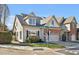 Charming home with a two-car garage, well-maintained lawn, and beautiful landscaping at 103 Aisling Ct, Cary, NC 27513