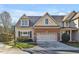 Charming home with a two-car garage, brick accents, and well-maintained landscaping at 103 Aisling Ct, Cary, NC 27513
