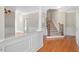 Inviting foyer with hardwood floors, staircase, and detailed white wainscoting at 103 Aisling Ct, Cary, NC 27513