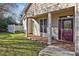 This home features a welcoming front porch with columns and a beautiful leaded-glass front door at 103 Aisling Ct, Cary, NC 27513