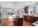 Spacious kitchen with a center island, granite countertops, and ample natural light at 103 Aisling Ct, Cary, NC 27513