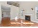 Bright and airy living room with hardwood floors and large windows at 103 Aisling Ct, Cary, NC 27513