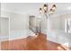 Open-concept living room featuring hardwood floors and staircase at 103 Aisling Ct, Cary, NC 27513