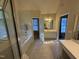 Bright bathroom featuring double vanity and makeup area with separate shower and tub at 105 Dairy Ct, Chapel Hill, NC 27516