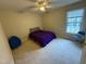 Bedroom with ceiling fan and large window providing natural light at 105 Dairy Ct, Chapel Hill, NC 27516
