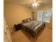 Comfortable bedroom with a ceiling fan and a large window with natural light at 105 Dairy Ct, Chapel Hill, NC 27516