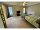 Comfortable bedroom featuring plush carpeting, a ceiling fan, and ample natural light at 105 Dairy Ct, Chapel Hill, NC 27516