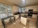 Modern kitchen with white cabinets, an island, and stainless steel appliances at 105 Dairy Ct, Chapel Hill, NC 27516