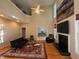 Spacious living room featuring a fireplace, vaulted ceiling, and comfortable seating at 105 Dairy Ct, Chapel Hill, NC 27516
