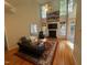 Bright living room with a fireplace, vaulted ceiling, and stylish furniture at 105 Dairy Ct, Chapel Hill, NC 27516