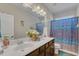 Spacious bathroom featuring double vanity, shower with blue patterned curtain, and white fixtures at 106 Neuse Bluff Cir, Clayton, NC 27527