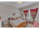 Bright bedroom with colorful decorations, natural light, and playful decor at 106 Neuse Bluff Cir, Clayton, NC 27527