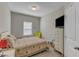 Cozy bedroom featuring neutral tones, natural light, and a comfortable queen-sized bed at 106 Neuse Bluff Cir, Clayton, NC 27527