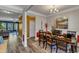 Traditional dining room with wood table, chairs, and an open view to the living area at 106 Neuse Bluff Cir, Clayton, NC 27527