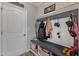 Well-organized entryway with a bench, hooks, storage shelves, and a door, perfect for keeping things tidy at 106 Neuse Bluff Cir, Clayton, NC 27527
