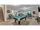 Spacious game room with a pool table and comfortable seating, perfect for entertaining guests at 106 Neuse Bluff Cir, Clayton, NC 27527