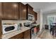 Kitchen with dark cabinets, stainless appliances, granite counters, and a breakfast area at 106 Neuse Bluff Cir, Clayton, NC 27527