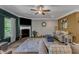 Cozy living room with a fireplace, ceiling fan, plush seating, and ample natural light, ideal for relaxing at 106 Neuse Bluff Cir, Clayton, NC 27527