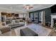 Open-concept living room with fireplace, seamlessly connecting to the kitchen and dining area at 106 Neuse Bluff Cir, Clayton, NC 27527