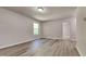 Bright bedroom featuring neutral walls, modern floors, and a sunlit window at 109 Stone Ridge Dr, Smithfield, NC 27577