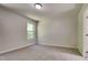 Bright bedroom featuring neutral walls, carpet flooring, and one window at 109 Stone Ridge Dr, Smithfield, NC 27577