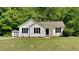 Charming single-story home with neutral siding, black shutters and a well-manicured lawn at 109 Stone Ridge Dr, Smithfield, NC 27577