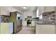 Stylish kitchen with white cabinets, stainless steel appliances, granite countertops, and mosaic backsplash at 109 Stone Ridge Dr, Smithfield, NC 27577