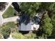 Overhead view of gray home featuring in-ground pool, outdoor kitchen, and mature trees at 110 Chapelwood Way, Cary, NC 27518