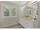 Bright bathroom with double vanity, neutral countertops, and plenty of natural light at 110 Chapelwood Way, Cary, NC 27518