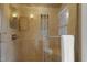 Tiled shower with glass door, chrome fixtures, mosaic inlay, and a mounted towel bar at 110 Chapelwood Way, Cary, NC 27518