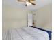 Bedroom featuring a queen bed, a ceiling fan, and doorway to other rooms at 110 Chapelwood Way, Cary, NC 27518