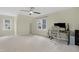 Spacious bedroom featuring neutral walls, a ceiling fan, and two windows letting in natural light at 110 Chapelwood Way, Cary, NC 27518