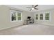 Bedroom with a ceiling fan and three large windows providing ample natural light for work or play at 110 Chapelwood Way, Cary, NC 27518
