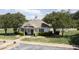 Charming clubhouse with green shutters and a decorative cupola and manicured landscaping at 110 Chapelwood Way, Cary, NC 27518