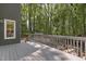 Exterior deck overlooking a lush, green backyard, perfect for outdoor relaxation and entertaining at 110 Chapelwood Way, Cary, NC 27518
