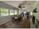Cozy dining room adjacent to the kitchen features updated lighting, hardwood floors, and large windows at 1102 Poplar Ave, Garner, NC 27529