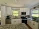 Kitchen featuring stainless steel appliances, granite countertops, white cabinets, and subway tile backsplash at 1102 Poplar Ave, Garner, NC 27529