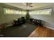 Home office featuring large windows, hardwood floors, and ample desk space at 1102 Poplar Ave, Garner, NC 27529