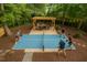 Entertain in this beautiful backyard with an outdoor dining area and a ping pong table at 1124 Hardimont Rd, Raleigh, NC 27609
