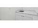 Bathroom sink with a marble countertop and shaker cabinet featuring minimalist pulls at 1124 Hardimont Rd, Raleigh, NC 27609