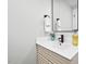 Bathroom with a modern black faucet, a big mirror, and a minimalist design at 1124 Hardimont Rd, Raleigh, NC 27609