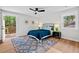 Relaxing bedroom with a deck, ceiling fan, and contemporary decor at 1124 Hardimont Rd, Raleigh, NC 27609