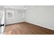 Bedroom with new floors and new ceiling fan, freshly painted in a neutral color at 1124 Hardimont Rd, Raleigh, NC 27609