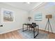 Bright bedroom featuring a modern desk, natural light, and stylish decor, perfect for a home office or guest room at 1124 Hardimont Rd, Raleigh, NC 27609